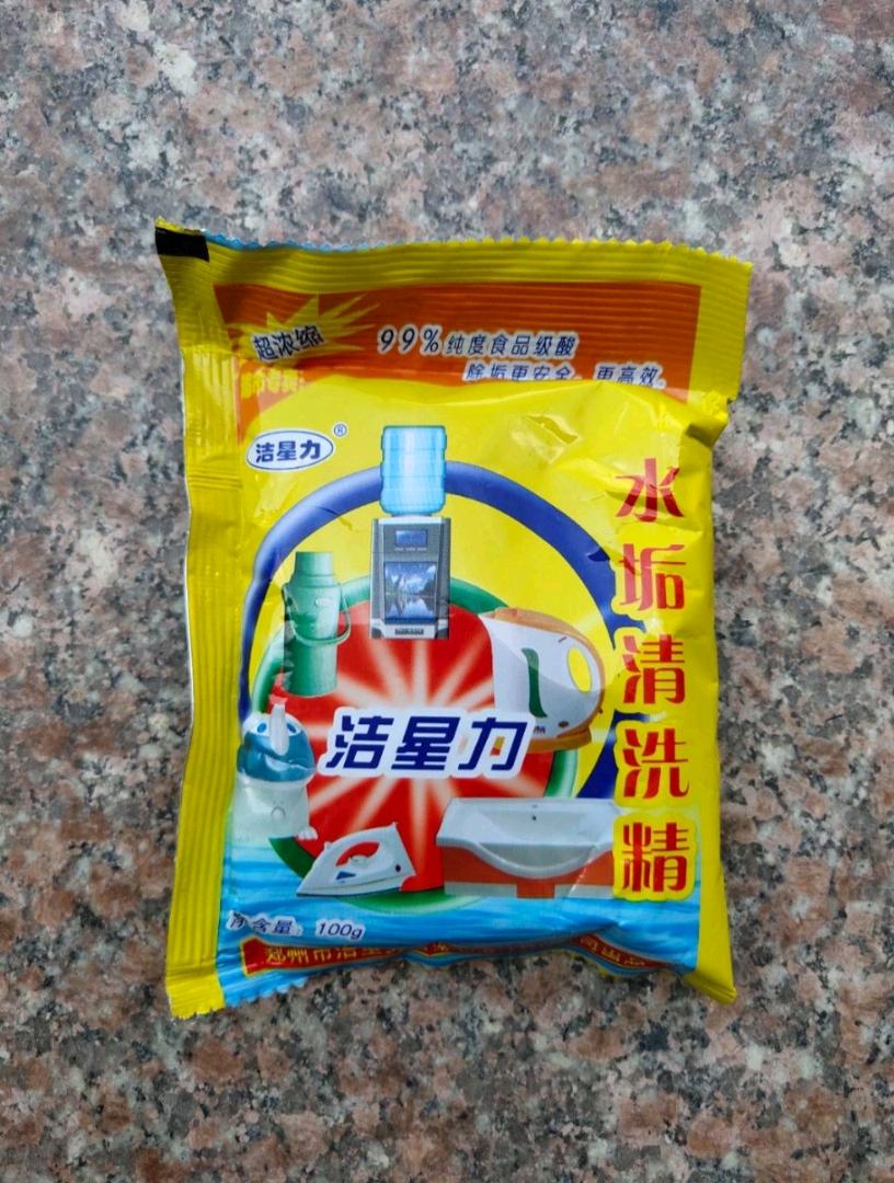 Scale cleaning agent