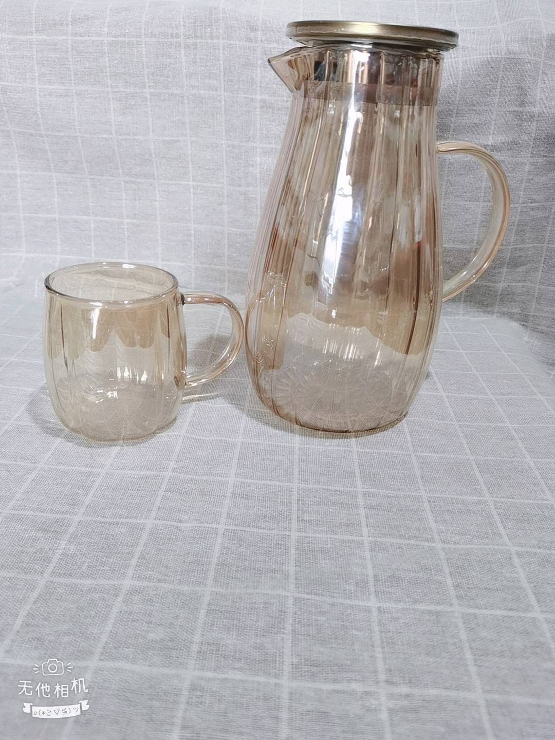 Heat resistant high borosilicate glass water kettle with Nordic style design, capable of cooling water and brewing tea for dual purposes